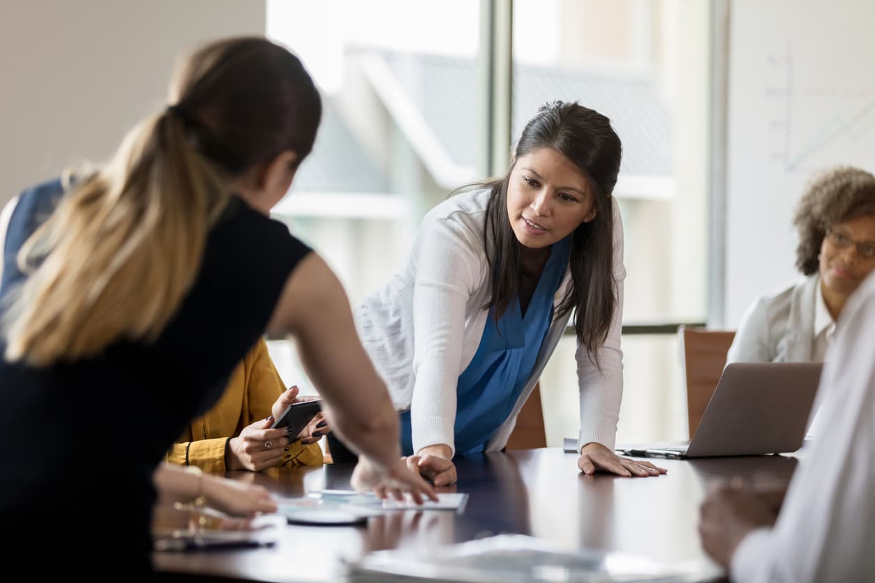 HOA members in an office discussing using reserve funds