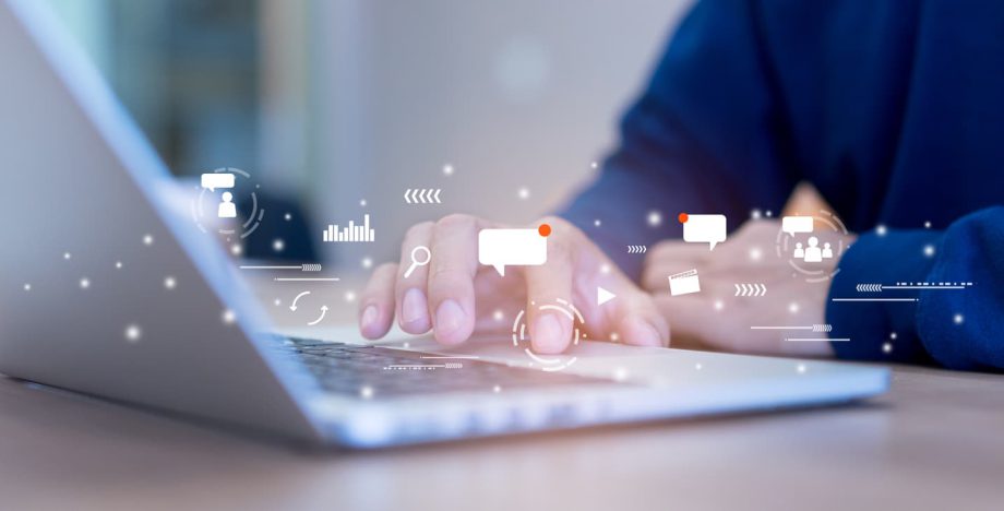 A person engaging in social media networking on a laptop