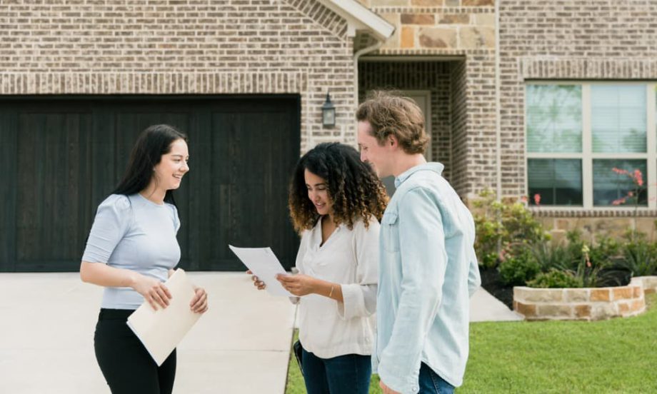A community manager showing a home to potential residents.