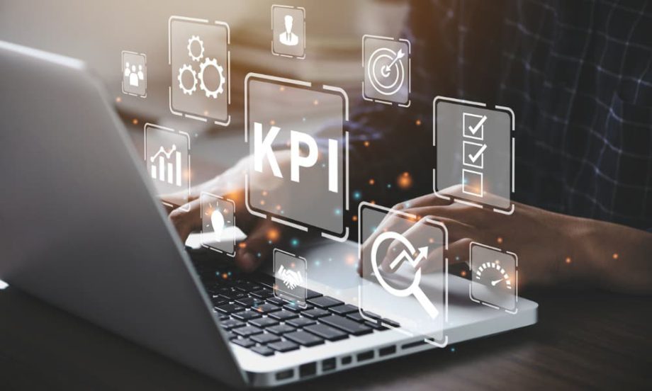 A laptop with graphics labeled “KPI” floating above it.